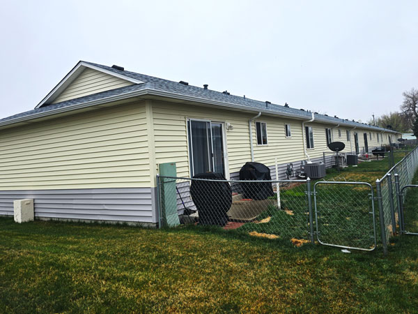 siding roofing gutters brush colo S Diligent Roofing Colorado New siding roofs gutters on a block of townhomes in Morgan County