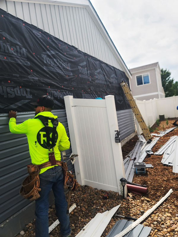 denver home siding installation Diligent Roofing Colorado The siding on this exterior wall was badly damaged by hail Diligent Roofing removed the old siding and replaced it while we replaced the roof